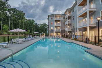 Outdoor saltwater pool with poolside lounging